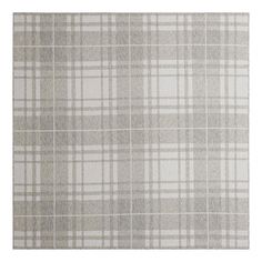 a gray and white plaid rug on a white background