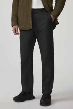 The Carlyle Quilted Pant is made with Nylon Pongee for water-repellent, wind-resistant protection with a smooth, sheen finish. It has an elasticized waistband and zipper fly and is equipped with two front side-entry pockets and a single back welt pocket,  providing optimal comfort with simple aesthetics. The Carlyle Pant is insulated with 100% TENCEL™ Lyocell, a biodegradable fibre made from wood pulp harvested from sustainably managed forests, with the same performance qualities as its down cou Simple Aesthetics, The Carlyle, Quilted Pants, Men Parka, Baby Outerwear, Mens Parka, Snow Pants, Bottom Clothes, Black Label