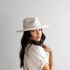 Arlo is an elevated straw fedora. Its teardrop crown + stiff upturned brim feature handwoven venting for a breezy feel + textured look. Arlo includes a hand-sewn leather band that is easily layered with other accessories. Style - Teardrop Rancher Material - Paper Straw Dimensions - Crown 11 cm Brim 8.5 cm Cream Band, Women Fedora, Gigi Pip, Hand Sewn Leather, Wide Brim Straw Hat, Straw Fedora Hat, Pressed Paper, Rancher Hat, Fedora Hat Women