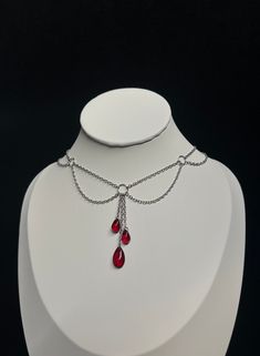 Elegant and refined, this necklace will highlight your neck. --------------------------- Fine mesh chain 0.2 x 0.3 mm in stainless steel Extension chain 2 x 3 mm in stainless steel Glass drop beads 15 x 8 mm for the large one, 10 x 5 mm for the small ones Zinc alloy clasps and connectors Minimum length: 30 cm* Maximum length: 40 cm* ⚠ All my jewelry is assembled by hand Jewelry resistant to time provided you take care of it, avoid contact with water. *Can be personalized --------------------------- ✺ Carefully packaged in tissue paper, slipped into an organza pouch and sent in a bubble wrap pouch, perfect as a gift! ✺ Reactive deposit, sending by followed green letter (FRANCE) --------------------------- ✺ Do not hesitate to contact me with any questions! --------------------------- Adjust Vampiric Jewelry, Blood Jewelry, Necklace Blood, Vampire Necklace, Vampire Jewelry, Steel Extension, Blood Drop, Beaded Necklace Designs, Organza Pouch