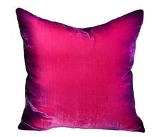 a pink pillow on a white background