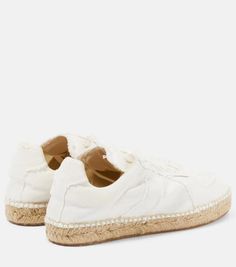 A combination of designs, these canvas sneakers from Maison Margiela are set on espadrille-style woven soles and have classic lace-up fastenings..Closure: lace-up.Lining: fabric.Sole: fabric insole, rubber sole.Toe shape: round toe.Trim: jute.Upper: fabric.comes with dust bags.comes with a box.Made in Spain.Fits large to size - we recommend trying one size smaller.European sizes.2cm-1' platform (size EU 38) Cream Lace-up Sneakers For Summer, Textile Lace-up Canvas Shoes With Contrast Sole, Textile Canvas Shoes With Contrast Sole, Cotton Sneakers With Textured Sole And Round Toe, Cotton Sneakers With Textured Sole, White Textured Sole Sneakers For Beach, White Beach Sneakers With Textured Sole, White Textured Sole Beach Sneakers, Beach Sneakers With Textured Sole And Lace-up Design