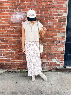 Put some flower power into your wardrobe with our Tammy Floral Midi Skirt! This ivory skirt features a red micro floral print and a comfortable elastic waistband. Perfect to pair with both graphic tees and sweaters, this midi skirt will add a playful touch to any outfit. Product Details: Measurements: WAIST small 13" medium 14" large 14.5" LENGTH small 34" medium 35" large 36" 100% polyester midi length elastic waist fully lined super comfortable model wearing size small model stats: size 4, 5'5 Casual Red Maxi Skirt For Fall, Casual White Skirt For Fall, Spring Daywear Maxi Skirt, White Maxi Skirt For Fall, Casual Maxi Skirt For Fall Daywear, Casual Fall Maxi Skirt For Daywear, Casual Red Maxi Skirt For Spring, Casual Maxi Skirt For Spring Daywear, Casual Midi-length Skirt With Floral Print