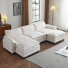 a large white sectional sofa in a living room