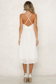 White midi dress. Lined. Cold hand wash only. Model is a standard XS and is wearing XS. True to size. Non-stretchy fabric. Invisible side zip. Print placement may vary. Polyester. Calling all sweethearts, our Count On Us Midi Dress was made for you! This flowy style features a pleated skirt, V neckline, invisible side zip and adjustable cross over shoulder straps. Style yours with mermaid waves and a beaded quarter bag! Mermaid Waves, Flowy Style, Midi Dress White, White Midi, Print Placement, White Midi Dress, Dress White, Stretchy Fabric, Pleated Skirt