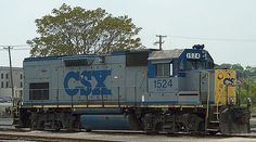 an old train is sitting on the tracks