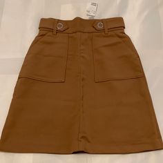 Brand New Brown High Waisted Midi Skirt From H&M. The Fabric Is Thick And Not Very Stretchy. 67% Polyester 33% Viscose. Super Cute And Closet Staple! High Waist Brown Skort With Pockets, Brown Mini Skirt For Summer Workwear, Brown Summer Mini Skirt For Workwear, Brown Mini Skirt With Pockets For Spring, Brown Mini Skirt With Pockets, Summer Brown Mini Skirt For Work, Spring Brown Mini Skirt With Pockets, Brown Mini Length Bottoms For Workwear, Brown Pencil Skirt With Pockets