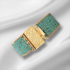 A beautiful picasso teal beaded cuff bracelet with gold trim and a gold filigree box clasp as a focal point. This boho bracelet is stackable with other bracelets or where it all alone for a unique look. Make a statement without saying a word.  Choose your length from the drop down menu. Treat yourself! Unique Gold Beaded Cuff Bracelet, Turquoise Beaded Cuff Bracelet For Gift, Bohemian Gold Cuff Bracelet With Round Beads, Gold Bohemian Cuff Bracelet With Round Beads, Artisan Gold Beaded Bracelets With Spacer Beads, Gold Artisan Beaded Bracelets With Spacer Beads, Artisan Beaded Gold Bracelets, Gold Artisan Beaded Bracelet With Spacer Beads, Artisan Turquoise Jewelry With Gold Beads