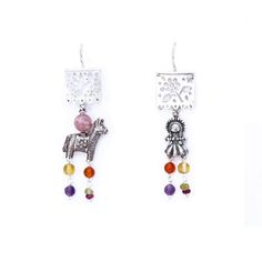 These earrings sound absolutely stunning! They're crafted from silver and feature piñata designs adorned with traditional Mexican muñeca Maria charms.  The designer, Gabriela Sanchez, has taken things to the next level by adding gorgeous touches of amber, amethyst, coral, and turquoise to the design. They are made in Mexico, so you can rest assured that they are authentic and made with incredible attention to detail. You'll definitely make a statement wearing these beautiful earrings! Silver .925 Earrings length: 2.5  inch approx. Papel Picado charm length: .5 inch Burrito and Muñeca charm length: .5 inch Fish hook. Artisan Dangle Earrings With Artistic Design, Bohemian Silver Earrings With Artistic Design, Bohemian Sterling Silver Clip-on Earrings For Gift, Handmade Bohemian Silver Clip-on Earrings, Bohemian Handmade Silver Clip-on Earrings, Handmade Bohemian Sterling Silver Clip-on Earrings, Bohemian Handmade Sterling Silver Clip-on Earrings, Artisan Silver Earrings With Artistic Design, Silver Artisan Earrings With Artistic Design