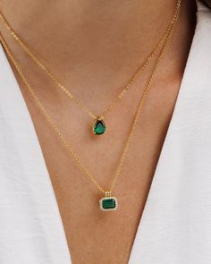 Introducing the Duchess Pendant Necklace with a stunning emerald green CZ stone - an elegant addition that adds a pop of color to your neckline. Crafted with timeless charm, the pendant showcases a classic emerald-cut stone design. The white CZ pave stones add a touch of sparkle, ensuring you'll shine in any crowd.   * Material: 18K Gold on Brass / Sterling Silver. * Special anti-tarnish protective coating. * Length: 16"+ 2" extender - 18" in total. * Stone: 5A Emerald green and white zirconia * Square Emerald Necklace, Elegant Rectangular Emerald Necklace For Formal Occasions, Elegant Rectangular Emerald Necklace For Formal Events, Elegant Rectangular Emerald Necklace, Elegant Green Emerald Necklace With Rectangular Pendant, Elegant May Birthstone Necklace With Rectangular Pendant, Elegant Emerald Necklace For May Birthstone, Elegant Green Rectangular Emerald Necklace, Classic Green Necklace With Rectangular Pendant