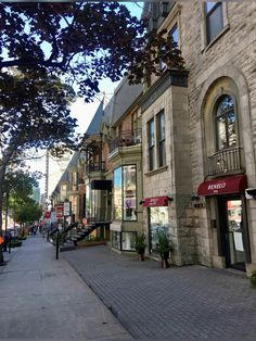 an empty street lined with buildings and shops