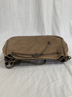 "Measurements are 12\"5 wide, 8\"3 high, 3\" deep with a 40\" shoulder strap. On the interior there is one main compartment with a back zipper pocket, lined in vinyl with a top magnetic closure. Bag is made of tan leather with taupe trim and front patches. Some light scuffs and some marks with no tears or holes and bag can be used crossbody. 100% genuine Carlos Falchi made in USA. I WANT TO STRESS THAT THIS ITEM IS VINTAGE WHICH MEANS IT'S NOT NEW. IF YOU'RE LOOKING FOR A NEW BAG PLEASE DON'T BI Taupe Trim, Bell Gardens, Taupe Leather, Purse Crossbody, Vintage Purse, Leather Hobo, New Bag, Magnetic Closure, Tan Leather