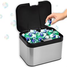 a person is opening an ice chest filled with bubbles