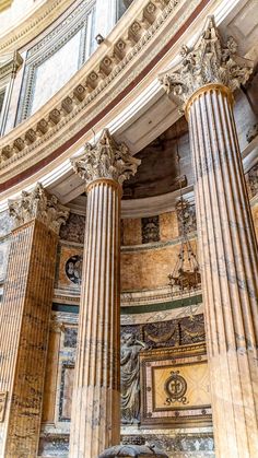 the interior of an old building with marble columns