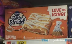 an assortment of frozen desserts are on display in a grocery store's shelf