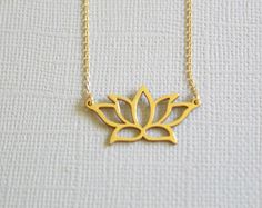 ✔️The most unique jewelry you can find, a perfect gift for you and your loved one. PRODUCT OVERVIEW Lotus Plant Gold Sterling Silver Charm Necklace Pendant Weight 0.096 oz (0.84g), Length 14.1mm (0.55 in) and Width 26.6mm (1.05 in)  It fits 41cm-46cm (16.1 inches to 18.1 inches) Adjustable Chain  Good for sensitive skin  Makes a great gift for any Anniversary, Engagement, Wedding, Birthday, Holiday, Promise, Graduation, Valentine's, or Special Occasion! LOTUS:  The meanings of the lotus flower, this plant is known to be associated with rebirth. This magnificent flower emerges from the dirty and unclean bottom of a pond but still remains untouched and unstained by the dirt and mud surrounding it in the pond. This unique quality of the flower is believed to represent the pure spirit, rebirth Small Minimalist Necklace As A Gift, Small Minimalist Necklace Perfect For Gifts, Minimalist Small Necklace Perfect For Gifts, Small Minimalist Necklace For Gift, Delicate Jewelry For Gifts, Delicate Small Jewelry Gift, Dainty Jewelry As A Gift, Adjustable Gold Necklace For Gifts, Dainty Small Jewelry For Gifts