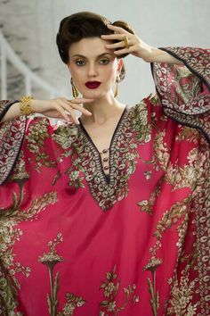 Fuchsia pink kimono sleeves kaftan with all over royal garden print and beaded embellishments on the neckline. - Aza Fashions Elegant Floral Print Festive Kaftan, Elegant Floral Embroidered Kaftan With Kimono Sleeves, Elegant Kaftan With Floral Embroidery And Kimono Sleeves, Elegant Maxi Kaftan With Printed Motifs, Pink Silk Kaftan With Dabka Work, Pink Bollywood Kaftan With Dabka, Pink Dabka Kaftan For Eid, Pink Embroidered Maxi Kaftan, Pink Embroidered Maxi Length Kaftan