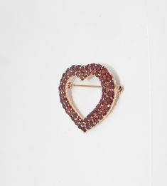 "A VERY IMPRESSIVE VINTAGE (I DO NOT KNOW HOW OLD EXACTLY) HEART SHAPED 32mm X 35mm (1.25\" X 1.5\") VERMEIL STERLING SILVER (MARKED 925) SET WITH APPROXIMATELY SIXTY FACETED NATURAL GARNET GEMSTONES. THE WORK IS VERY GOOD INDEED AND THE PIN IS UNDAMAGED AND APPEARS LITTLE USED if at all. $9.95 INSURED USA SHIPPING." Vintage Heart-shaped Brooch Jewelry, Vintage Heart Shaped Brooch Jewelry, Antique Heart Brooch For Wedding, Vintage Brooch For Valentine's Day Formal, Vintage Heart-shaped Collectible Brooch, Collectible Vintage Heart-shaped Brooch, Vintage Heart Shaped Brooch, Vintage Heart Shaped Collectible Brooch, Antique Heart-shaped Wedding Brooch