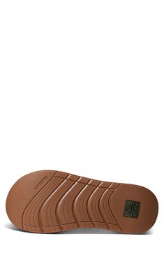 This water-friendly flip-flop grounds you on a contoured footbed and textured rubber sole for stability and traction. Slip-resistant sole Synthetic upper/textile and synthetic lining/rubber sole Imported Foam Slides With Rubber Sole And Round Toe, Foam Slides With Round Toe And Rubber Sole, Brown Outdoor Slides With Rubber Sole, Brown Outdoor Sandals With Textured Sole, Brown Slides With Rubber Sole For Outdoor, Synthetic Slide Flip Flops With Textured Sole, Synthetic Low-top Sandals With Textured Footbed, Synthetic Textured Sole Slide Flip Flops, Beach Sneakers Slip-resistant And Synthetic