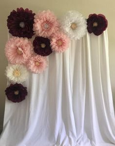 the flowers are hanging on the curtain