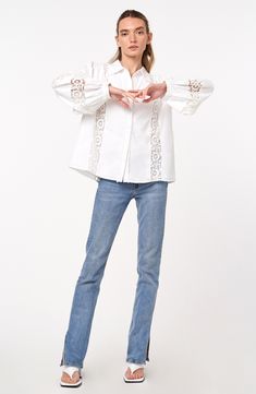 This classic cotton shirt is sweetly updated with lacy accents and charming circle trim. 24 1/2" length Front button closure Spread collar Long sleeves with button cuffs 100% cotton Hand wash, dry flat Imported Asian & Pacific Islander Owned/Founded Casual Broderie Anglaise Shirt For Spring, Spring Lace Trim Button-up Shirt, Classic Shirt With Lace Collar For Spring, Spring Lace Collar Button-up Shirt, Casual Button-up Shirt With Lace Trim, Cotton Eyelet Blouse With Relaxed Fit, Spring Collared Shirt With Lace Trim, Collared Shirt With Lace Trim For Spring, Cotton Blouse With Lace Cuffs