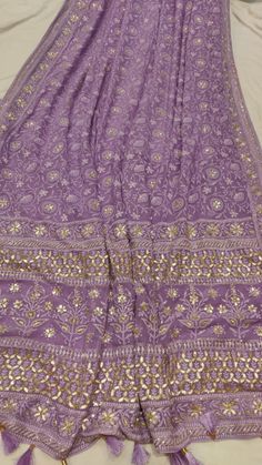 Chikankari Georgette fabric with hand gotapati work and katdana work. Eid Georgette Pre-draped Saree With Gota Work, Festival Chanderi Pre-draped Saree With Gota Work, Unstitched Purple Pre-draped Saree With Dori Work, Traditional Designer Pre-draped Saree With Gota Work, Pre-draped Anarkali Saree With Gota Work, Diwali Dola Silk Pre-draped Saree With Gota Work, Purple Pre-draped Saree With Dori Work, Diwali Pre-draped Saree With Chikankari Embroidery In Chinon, Gota Work Embroidered Fabric For Designer Wear