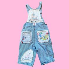 Let's Kitch-ify some overalls ! 100% Upcycled and eco friendly vintage overalls  given new life with the addition of vintage embroidery, hankies, and textiles ✨ To give it that crazy quilt feel, I've hand embroidered stitches to the pieces, a absolute labor of love ❤️ Measurements: Bust: free: Waist: 30 in. Hip: 36 in. Inseam: 11 in. Length: 22 in. Total rise: 20-22 in. All items are made of true vintage materials and maay show signs of the age. Please look at pictures closely. Vintage Denim Overalls With Patchwork, Vintage Cotton Patchwork Overalls, Vintage Cotton Overalls, Upcycled, Casual Upcycled Cotton Overalls, Casual Cotton Upcycled Overalls, Casual Cotton Overalls Upcycled, Vintage Patchwork Overalls, Embroidery Hankies, Farmer Overalls