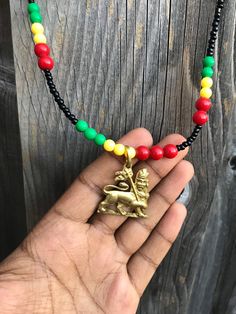 "one of a kind unisex Rastafari necklace. This necklace is authentic, and it' comes with one hand bracelet Ethiopian handmade. This lion of Judah measures about :-  1.17\" (30 mm)  Rastafari jewelry for men and women. Lion of Judah ️ roots Dub KING JAH" Jamaica Fashion, Hand Bracelet, Lion Of Judah, Gift Item, Jewelry Necklace Pendant, Mens Jewelry, Handmade Jewelry, Handmade Items, Jewelry Necklaces