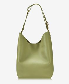 Introducing our soft, slouchy Relaxed Pebble Hobo – the perfect companion for work-to-weekend versatility. With ample room for all your essentials, this hobo effortlessly transitions from the office to weekend adventures. Complete with a detachable, unlined zipper pouch, it's designed to keep your must-haves organized on the move. Experience style and functionality combined in our Relaxed Pebble Hobo. Pebble Grain Leather Unlined hobo Handcrafted Magnetic top closure Detachable unlined zipper pouch (8” W x 6” H) Convertible shoulder strap (18.5” & 11” drop) Size: 17” W x 5” D x 14” H Modern Everyday Hobo Bag For Fall, Versatile Green Hobo Bag, Everyday Green Hobo Bag, Versatile Hobo Bag For Work, Notebook Shop, Weekend Adventures, Leather Decor, Best Wallet, Wallet Bag