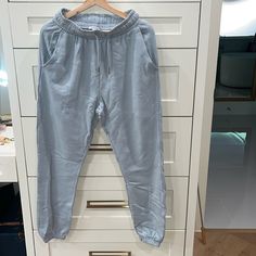 Brand New 100 % Cotton Light Wash Denim Bottoms For Loungewear, Denim Blue Loungewear Bottoms With Elastic Waistband, Denim Pants With Elastic Waistband For Loungewear, Trendy Denim Pants For Loungewear, Spring Denim Blue Loungewear Pants, Spring Loungewear Denim Blue Pants, Relaxed Fit Denim Bottoms For Loungewear, Light Wash Casual Loungewear Bottoms, Wide Leg Denim Loungewear Pants