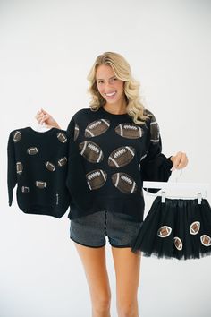 This MINI KIDS FOOTBALL LOVER SWEATER is perfect for young football fans. It is made of a black sweater that features unique football patches, making it ideal for game days, practice days, or any day! Its comfy construction and stylish patches make it a must-have for any mini fan. All orders are currently shipping within 14 business days. To receive item quicker, expedited shipping is available at checkout. Saints Game, Black Tutu, Football Lover, School Collection, Cropped Pullover, Football Kids, Black Pullover, Football Lovers, Mini Fan