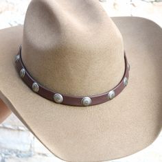 Artists: Steve and Brenda Lampman; 40+ years hand making goods out of buttery deer hides. No power tools used, only hands craft each and every piece.Customizations: Upon request, this hat band can be crafted in many other colors. Instead of braided knobs, it can be finished with long leather tassels. And different conchos are also available. Please allow up to 6 weeks for custom requests. Deerskin Leather Handmade in the USA Hand-braided Adjustable Hat is not included Hands Craft, Brown Leather Hat, Deer Hide, Montana Usa, Hat Bands, Leather Hat, Hand Making, Leather Hats, Deer Skin