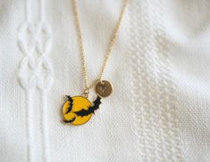 Introducing our must-have Halloween accessory: the Bat Over the Moon necklace! This cute necklace is perfect as a gift or for adding some fun to your Halloween party outfit. Unique and stylish, it's a must-have for the spooky season. * How To Order 1. Choose the size. 2. Select initials, if you do not want any initial, select "NONE" (UPPER CASE and HEART Shape Available) if you want LOWERCASE please message me BEFORE placing the order!) 3. Add to cart and submit order :) * Charm: Rack Plating Alloy Enamel Pendants, Cadmium Free & Nickel Free & Lead Free * Charm size: 0.94 H  x 0.85 W * Initial Disk: 10mm stainless steel gold * Chain: 18K Gold Plated over Stainless Steel * The color displayed may vary depending on your screen. *Free Shipping Eligible for orders $35.00 or more 🌟Caring tip f Halloween Moon Charm Jewelry As Gift, Halloween Novelty Necklaces As Gift, Halloween Gift Necklace With Lobster Clasp, Cute Customizable Black Jewelry, Halloween Novelty Jewelry With Charms, Personalized Halloween Jewelry Gift, Halloween Themed Jewelry Gift, Halloween Novelty Personalized Jewelry, Personalized Themed Jewelry For Halloween