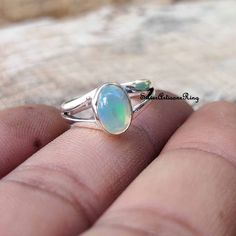 Spiritual Oval Stackable Jewelry, Oval Spiritual Rings With Polished Finish, Oval Spiritual Ring With Polished Finish, Adjustable Oval Spiritual Rings, Spiritual Oval Stackable Moonstone Ring, Spiritual Oval Moonstone Stackable Ring, Spiritual Oval Opal Promise Ring, Oval Sterling Silver Crystal Promise Ring, Dainty Handmade Oval Opal Ring