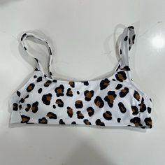 Xhilaration By Target Cow Print Bikini Top. Size Medium. Never Worn. Too Small White Stretch Triangle Top Tankini, White Seamless Swimwear For Vacation, White Seamless Summer Swimwear, Seamless White Summer Swimwear, Summer White Tankini With Adjustable Straps, White Swimwear With Adjustable Straps For Vacation, White Tankini With Adjustable Straps For Beachwear, White Adjustable Straps Swimwear For Summer, White Seamless Swimwear For Sunbathing