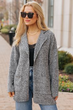 Experience ultimate style with our Classy Elegant Wool Coat! Designed with a notched collar, front patch pockets, and an oversized fit, it's perfect for both formal and casual occasions. Made with a blend of high-quality wool, acrylic, polyester, and nylon, it offers both comfort and style all day long. Layer it over a basic long sleeve top, elevated shorts, and knee high boots for a chic day or night outfit! Notch Lapel Cardigan For Workwear In Fall, Notched Outerwear With Welt Pockets For Fall, Fall Cardigan With Notch Lapel For Workwear, Gray Fall Blazer With Pockets, Gray Fall Blazer, Gray Blazer With Pockets For Fall, Gray Casual Sweater Coat For Work, Notched Outerwear With Pockets For Fall, Casual Notch Lapel Cardigan For Winter