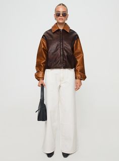 Oversized bomber jacket  Faux leather, classic collar, exposed zip fastening, internal hem toggles, contrast sleeves, twin hip pockets  Non-stretch material, fully lined     55% PU 45% polyester Fall Leather Jacket With Contrast Collar, Retro Brown Outerwear With Zipper Closure, Trendy Brown Outerwear With Ribbed Cuffs, Fall Streetwear Outerwear With Contrast Collar, Fall Outerwear With Contrast Collar For Streetwear, Contrast Collar Outerwear For Fall Streetwear, Fall Brown Outerwear With Contrast Collar, Retro Fall Outerwear With Contrast Collar, Fall Streetwear Leather Jacket With Zip Cuffs