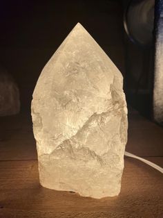 a white rock sitting on top of a wooden table