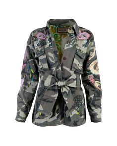 Our meticulously crafted jacket is a true embodiment of versatility and bohemian extravagance. Adorned with intricate embroidery on the sleeves, front pockets, chest, and back, it commands attention wherever you go. While the rugged camouflage fabric offers durability, the luxurious tropical printed silk lining offers a touch of lavishness. Elevate your style with the optional matching tie belt, while the dark-hued logo-engraved buttons add a timeless charm to this contemporary piece. Crafted fr Mystical Goddess, Camo Jacket Outfit, Camouflage Outfits, Diy Fashion Accessories, Blazer Jackets For Women, Expensive Taste, Diy Clothing, Camo Jacket, Intricate Embroidery