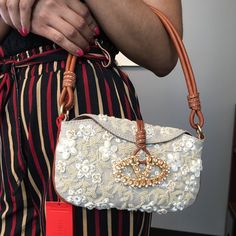 A Very Elegant Evening Bag -Tan Lining Adorned With Handcrafted Pearl Beads, Clasp Is Embellished With Pink Stones In Signature V Closure, Has Additional Beads For Repair. Leather Handle, One Of A Kind Authentic. New With Tags And Dust Bag. Large Enough For Phone Credit Cards Lipsticks Wallet Etc. This Is A Vintage Piece.. Vintage Valentino Bag, Designer Beige Evening Bag With Detachable Strap, Designer Beige Clutch Evening Bag, Designer Cream Shoulder Bag For Evening, Luxury Embellished White Bags, Luxury White Embellished Bag, Luxury White Embellished Bags, Evening Beige Embellished Shoulder Bag, Luxury Embellished Shoulder Bag For Shopping