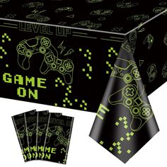 an image of a table cloth with video game controllers on it and matching napkins