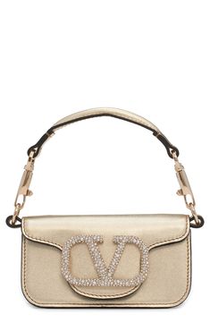 Create a sparkling finish to your look with a gilded handbag embellished with a crystal logo closure. Magnetic-snap closure Removable top carry handle; pull-through chain strap Structured silhouette with flat base for stability Leather Made in Italy Designer Handbags Crystal Logo, Metallic Leather, Chain Strap, Valentino Garavani, Snap Closure, Designer Handbags, Leather Shoulder Bag, Nordstrom, Shoulder Bag