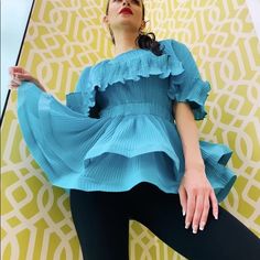 This Very Versatile Ruffle And Bounce Top Promises A Chic Look You Can Wear Day Or Night. Made With Exquisite Fabric. Blue Pleated Summer Tops, Blue Pleated Tops For Summer, Blue Ruffled Party Tops, Fitted Light Blue Ruffled Blouse, Top For Women, Chic Look, Woman Colour, Color Blue, Blouses