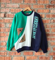 Vintage 90s Enrico Italy Sweatshirt Italy Crewneck Italy Pullover Italy Jumper Embroidery Patch Blue, Green, White Color Men's L Label : Enrico Albani Italy Label Size : L (refer the measurement) Made in China Materials from 100% Cotton  Used Item With Condition 8/10 Refer Picture. Stain and No Holes. Lay Down Flat Measurement : - Width (armpit to armpit) and: 23.5 Inches - Length (shoulder to end of garment): 27 Inches We are selling used clothing with good condition. DO NOT EXPECT the item is College Crew Neck Patchwork Sweatshirt, Retro Patchwork Sweatshirt For Streetwear, Vintage Embroidered Sweatshirt For Streetwear, Vintage Patchwork Tops For Streetwear, Vintage Crew Neck Patchwork Tops, Vintage Long Sleeve Patchwork Sweatshirt, Vintage Patchwork Crew Neck Top, Vintage Crew Neck Patchwork Sweatshirt, Vintage Crew Neck Sweatshirt With Patchwork