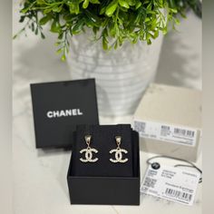 Classic Chanel Cc Earrings With Crystals In Drop / Dangle Style Super Cute For Daily Wear Brand New With Tag. Come With Everything Like You Bought From The Boutique (Box, Pouch, Care Book, Camellia Flower And Ribbon) 100% Authentic. Will Also Go Through Poshmark Authentication Before It Delivers To You So You Can Buy With Confidence Price Is Firm On Here Chanel Jewelry Earrings, Cc Earrings, Earrings With Crystals, Chanel #1, Classic Chanel, Jewelry Chanel, Box Pouch, Plastic Earrings, Camellia Flower