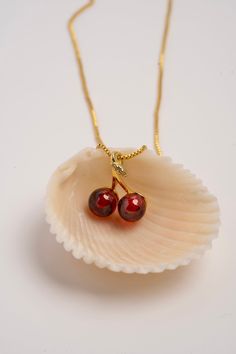 This exquisite piece features two meticulously crafted cherries on a delicate chain, symbolizing life's fleeting sweetness. Wearing it reminds you to savor every moment. Whether it's a casual day or a special occasion, our Cherry Necklace is a stylish, meaningful accessory, reflecting your appreciation for life's simple joys.  Product ships from the USA within 1-3 days If there's anything you're unsure of or would like to clarify, please don't hesitate to reach out. We'd be more than happy to assist you. Thank you for shopping with Daydreambasket! Please check out our store for more lovely products https://etsy.me/3fv5TGq Follow us on Facebook @daydreambasket Instagram @daydreambasket Tiktok @daydreambasket Red Pearl Pendant Jewelry Gift, Red Pearl Pendant Jewelry For Gift, Red Charms Necklace For Valentine's Day, Handmade Cherry Jewelry For Gift, Elegant Cherry Color Necklace For Gift, Elegant Cherry Colored Necklace For Gift, Cherry Necklace Gold, Valentine's Day Red Pendant Charm Necklaces, Valentine's Day Gold-tone Charm Necklace