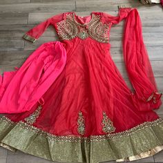 Rand New Never Worn Indian Anarkali Suit Heavy Work Done Nice Flow To The Bottom Says It’s A Size 42 Which Is A Medium. Can Be Taken In Or Out Has A Side Zip For A Better Fit Will Ship Asap Anarkali Choli With Self Design For Eid, Gold Fitted Anarkali Churidar, Anarkali Long Semi-stitched Choli, Fitted Long Choli With Dabka Work, Fitted Long Anarkali Style Sharara, Long Semi-stitched Choli For Festive Occasions, Fitted Long Choli For Diwali, Bollywood Style Long Fitted Choli, Long Fitted Bollywood Choli