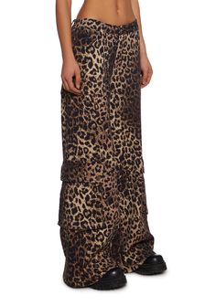 These pants have a stretchy twill construction with an all-over leopard print, a wide leg, cargo pockets on the legs with snap button closures, front and back pockets, and a front button and zipper closure. Dolls Kill Outfits, Wide Leg Cargo Pants, Y2k Fashion, Long Pants, Dolls Kill, Tank Dress, Exclusive Collection, Snap Button, Cargo Pants