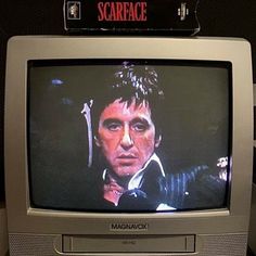 an old television with the image of scarface on it