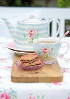 a cup of tea and some food on a table